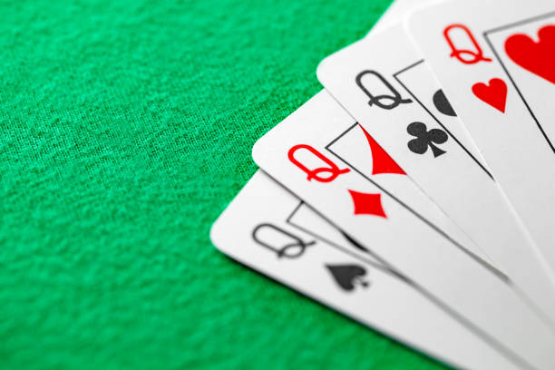 istock Poker combination quads - four cards of the same value queen, selective focus 1492982194