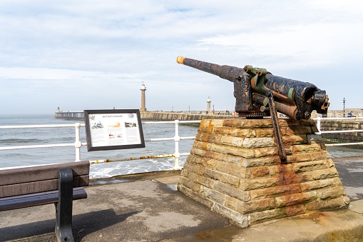 Whitby, United Kingdom – May 05, 2023: Battery Parade in the town of Whitby, North Yorkshire, UK, a historic site with an old mounted gun for coastal defence.
