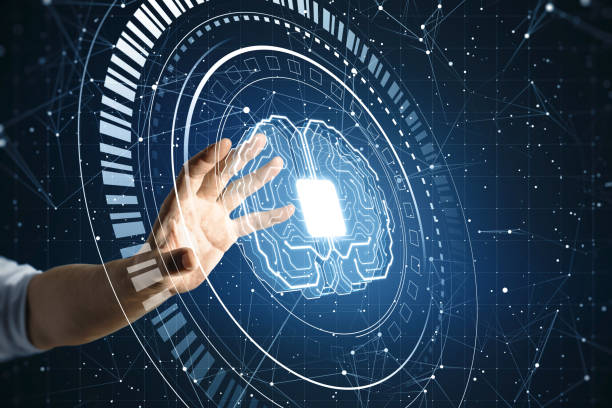 Cyber technology, artificial intelligence and machine learning concept with man hand touching digital screen with microcircuit with processor in form of human brain on abstract blue background stock photo