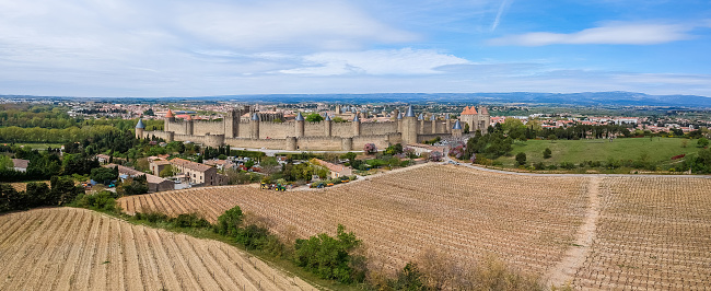 French ancient town Carcassonne panoramic view. Old castle with high stone walls. Famous tourist destionation in France, South Europe.