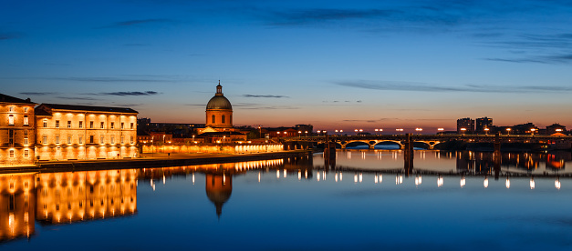 French city Toulouse and Garonne river night view. France. Europe