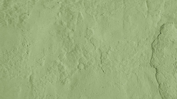 Stucco plaster wall background texture of khaki painted cement, concrete wall