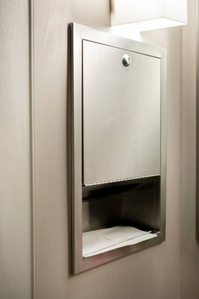 istock Paper towel holder hanging on the concrete wall. 1492991805