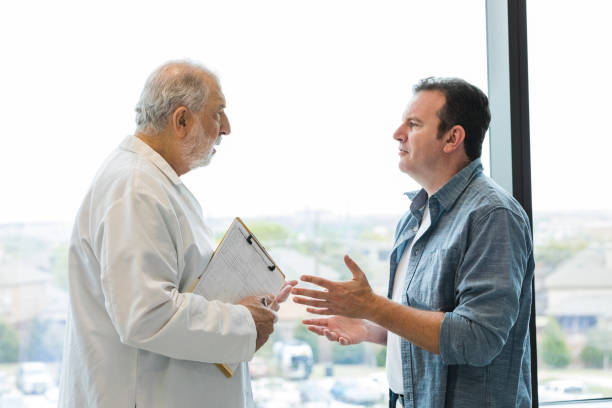 istock Mid adult man struggles to understand diagnosis 1492993771