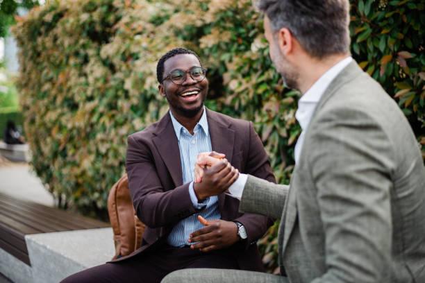 istock Two businessmen talking outside at business district 1492997352