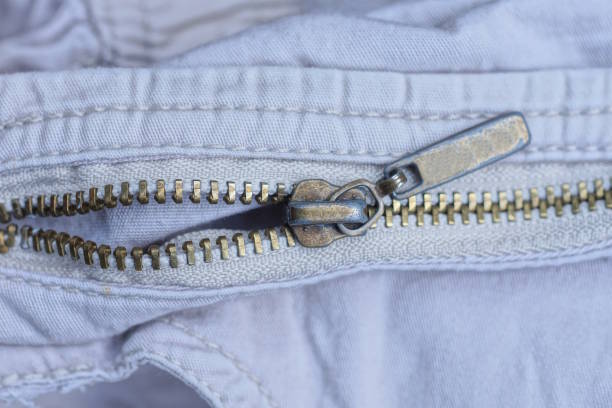 istock brown metal zip on white wrinkled clothing 1492997405