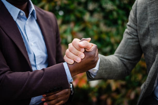 istock Two businessmen talking outside at business district 1492997415