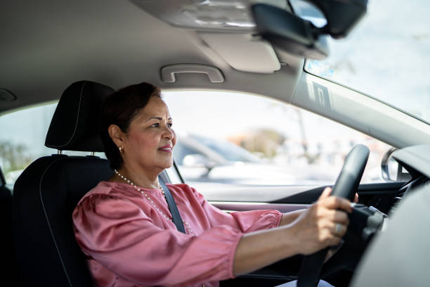 istock Mature woman driving inside a car 1493000981