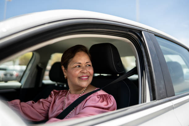 istock Mature woman driving inside a car 1493000988