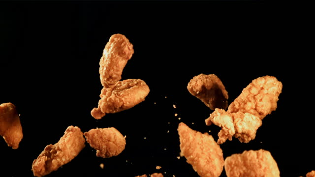 Nuggets fly up and fall down. Filmed is slow motion 1000 fps.