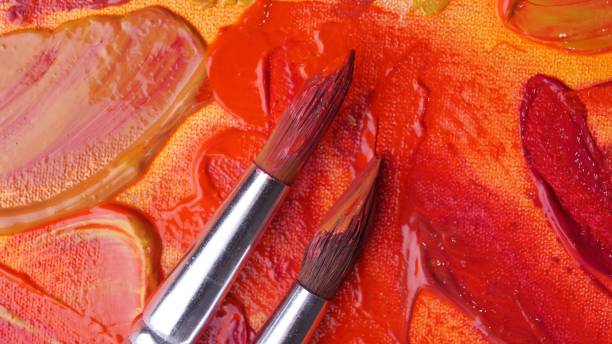 istock Brushes on artist's palette with mixed paints, top view 1493002677