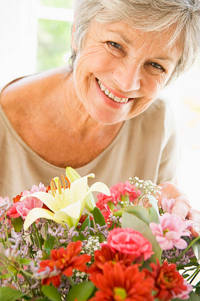 istock Woman with flowers smiling 149300371