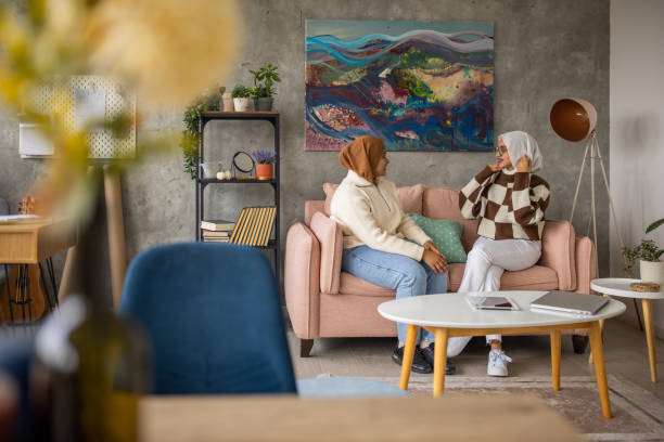 istock Female friends sitting at home 1493005802