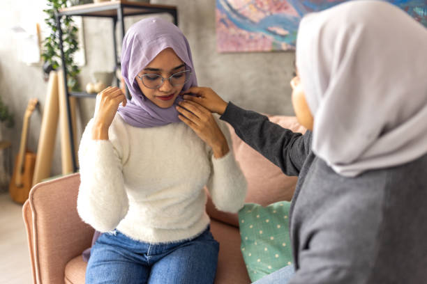 istock Woman putting on a hijab 1493006682