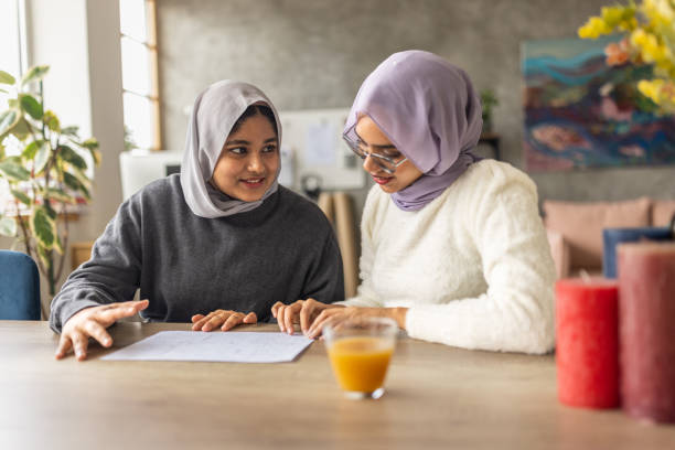istock Friends looking at apartment blueprint 1493006782