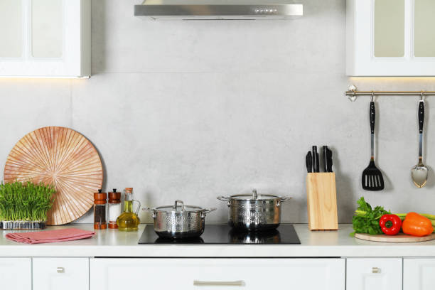 istock Countertop with different cooking utensils and ingredients in kitchen 1493008492