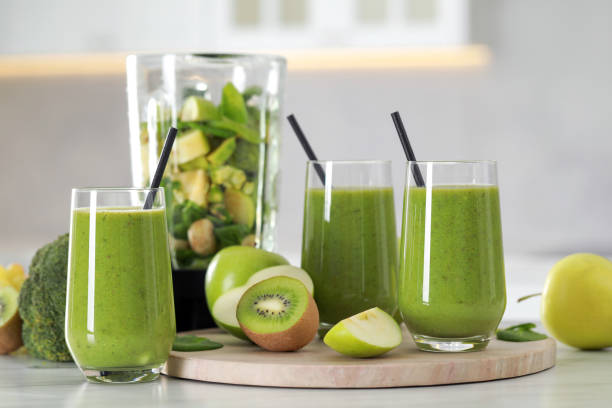 istock Delicious fresh smoothie and blender with ingredients on white marble table indoors 1493008510