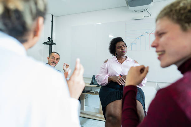 istock group of employees are gathered in a boardroom talking about labor issues 1493015521
