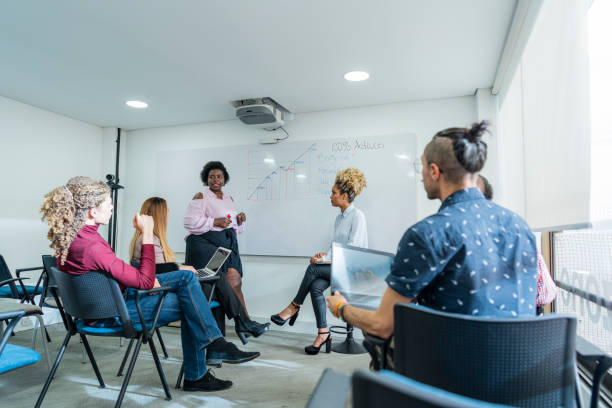 istock group of employees are gathered in a boardroom talking about labor issues 1493015566
