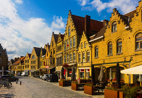 Picturesque view of Diksmuide street with typical residential buildings on sunny summer day, Belgium