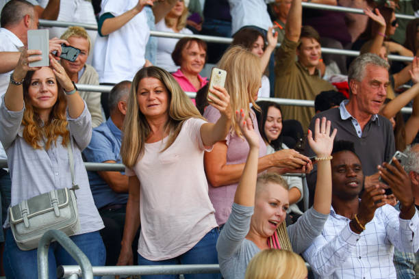 istock People taking a selfies at a footbal match 1493017213