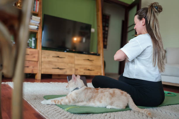 istock Pregnant Woman Exercises and using digital tablet At Home 1493019997