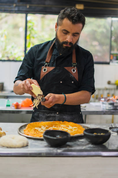 istock Chef is preparing vegan pizza at restaurant 1493024140