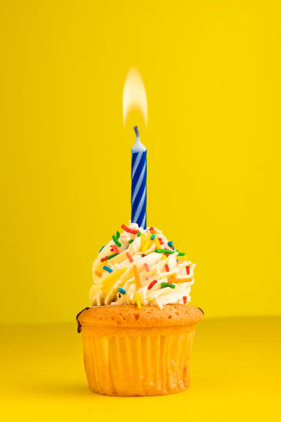 istock Birthday cake with number 1 candle - yellow background 1493029165