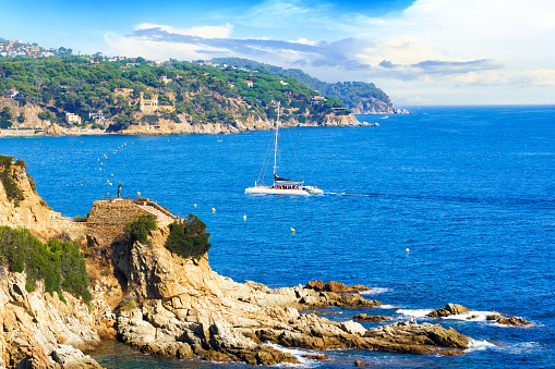 Picturesque landscape of the Mediterranean Sea and mountains within the city of Lloret de Mar in sunny day. Costa Brava, Girona, Catalonia, Spain