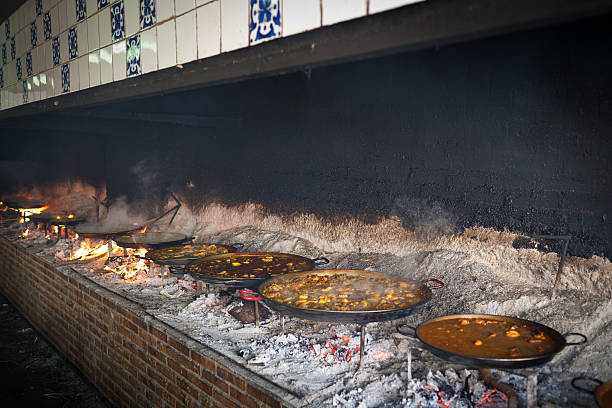 istock Valencian paella cooking on log fire 149304178
