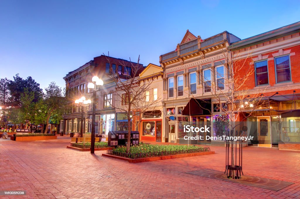 Pearl Street in Downtown Boulder Boulder is 25 miles northwest of the Colorado state capital of Denver. Boulder - Colorado Stock Photo