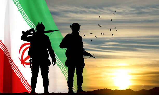 istock Silhouettes of a soldiers against the sunset with Iran flag 1493064949