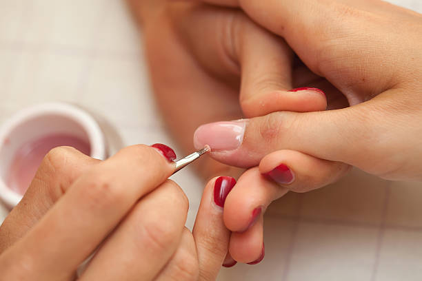 istock Female hands and manicure related objects in spa salon. 149306795