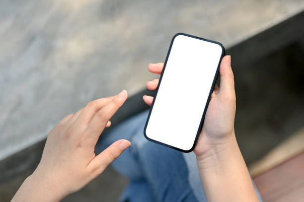 istock A smartphone mockup is a woman's hand over blurred background. 1493068462