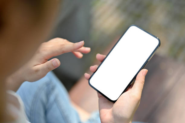 istock Top view image of a female using her smartphone while relaxing outdoors. 1493068478