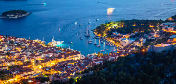 istock Aerial view of Hvar rooftops and harbor evening panoramic view 1493073169