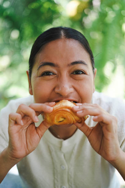 istock Women enjoy eating bread 1493073170