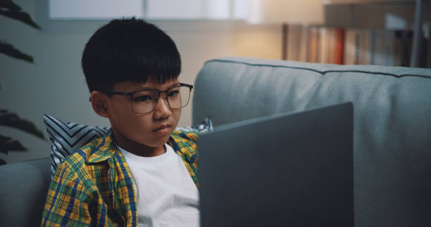 Free Stock Photo of Smart boy use laptop computer to learning online at ...