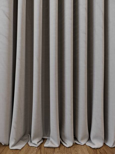 istock grey curtain with wood floor, 3d render 1493080229