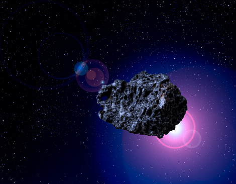 Close-up of Asteroid in outer space against deep universe with copy space.