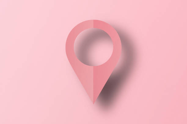 istock Pink paper cut into shapes, placement pins. pointer pad location mark set on pink paper background 1493094083