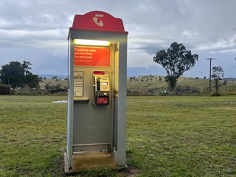 Dorrigo, Nsw - Mar 28 2023:Telecom phone booth in remote location in Australia.Telecom is Australia's largest telecommunications company by market share.