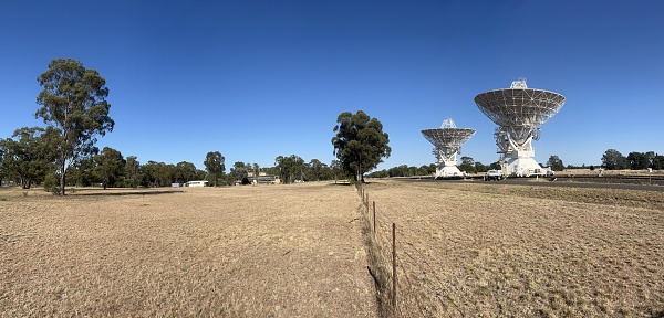 Narrabri, Nsw - Mar 03 2023:Two radio telescope antennas, near Narrabri NSW, of Australia Telescope Compact Array,observe star formation, the late stages of stars lives, supernovae and magnetic fields.
