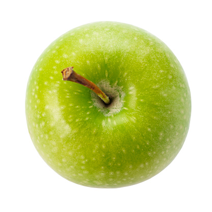 Stock photo showing close-up view of a red apple on top of a group of green Granny Smith apples with shiny, speckled skin. Odd one out concept.