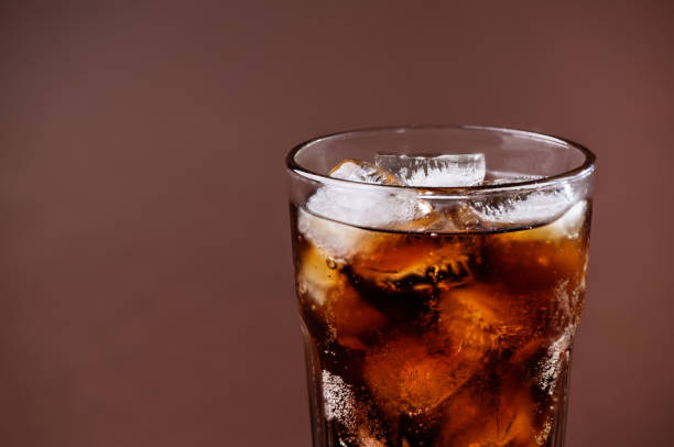 istock A glass of cola drink with ice cubes. 1493095103