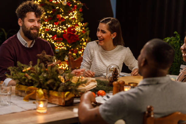 istock Friends laughing, chatting and bonding during a Christmas dinner party 1493095558