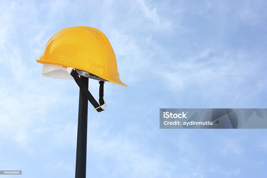 Construction Hard hat against the sky. Construction Site Stock Photo