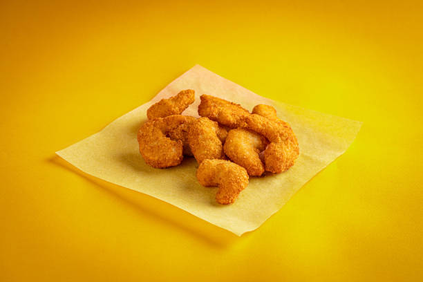 istock Fried chicken nuggets on a yellow background 1493105619