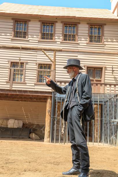 Gran Canaria - April 2023: Sioux City park offers the chance to interact with the park's cowboy actors, who are dressed in authentic Wild West costumes and act out various scenes throughout the day.