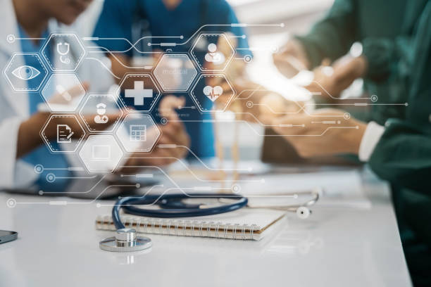 istock Medical technology concept. Doctor working with mobile phone and stethoscope and digital tablet laptop in modern office at hospital in morning light. 1493113652